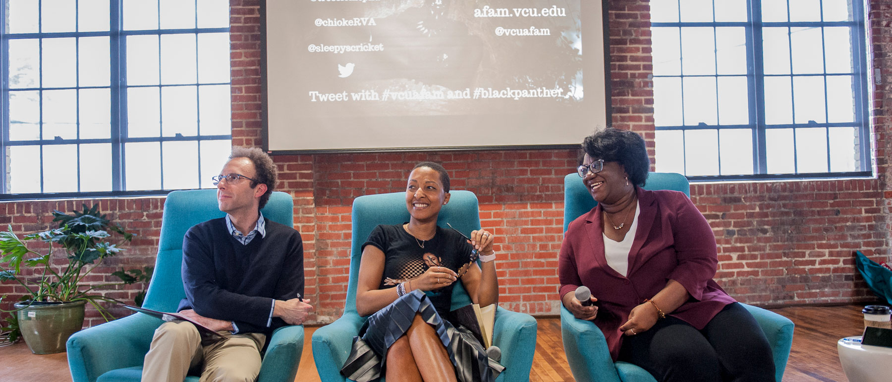 v.c.u. professors participating in a panel discussion about the move 'black panther'