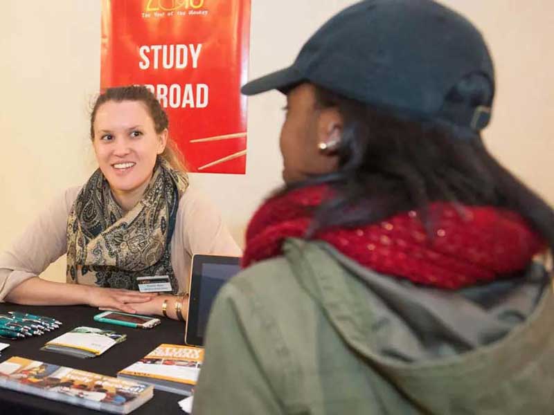 a v.c.u. student talks to a member of the study abroad program