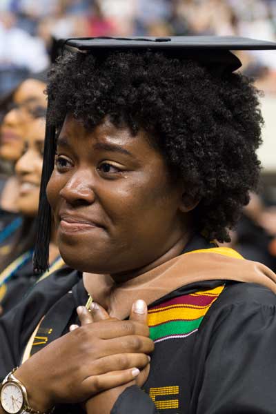 an emotional student graduate attending her commencement ceremony at v.c.u.
