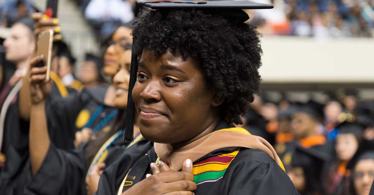 an emotional student graduate attending her commencement ceremony at v.c.u.